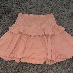Peachy coral mini ruffle skirt.